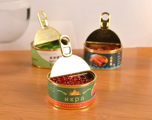 Macro detail of miniature canned food models featuring salmon and caviar on a wood surface