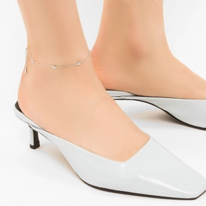 Minimalist S925 sterling silver anklet paired with light blue pointed kitten heel shoes