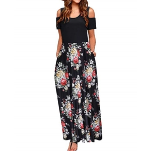 Detail of cold shoulder design and floral print on a black casual maxi dress