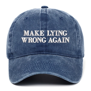 Detailed white embroidery of Make Lying Wrong Again text on washed denim baseball cap