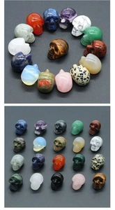 Various 1-inch natural crystal skull carvings in a neat grid and circular display