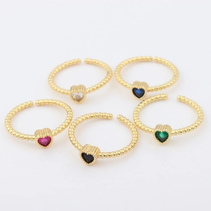 Detailed top view of 18k gold plated heart rings with colorful zircon stone settings