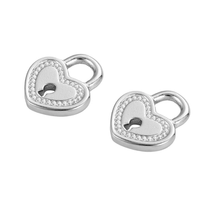 Detail of silver heart-shaped lock pendants with keyhole and beaded edges for DIY jewelry