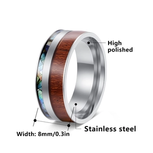 Polished 8mm stainless steel ring featuring acacia wood and rainbow abalone shell inlay