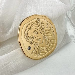 Vintage gold-plated stainless steel coin ring featuring a detailed portrait relief and zircon