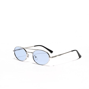 Silver metal sunglasses with blue oval lenses and retro double bridge in top-down view