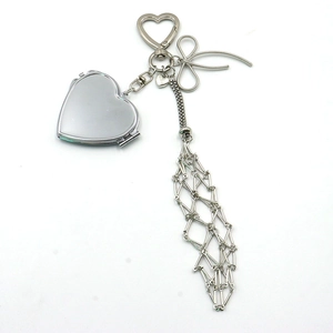 Polished silver heart mirror keychain with mesh chain tassel and bow detail