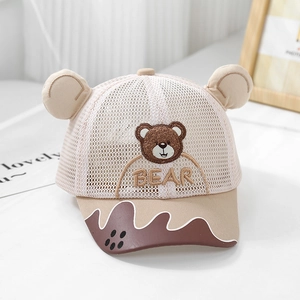 Detail of baby sun hat with cute 3D bear ears and breathable mesh fabric in beige