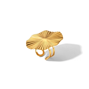 Close-up of golden fan-shaped stainless steel ring with adjustable open band design