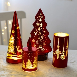 Mini red Christmas tree candle lanterns set with golden deer and snowflake patterns