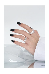Macro detail of S925 sterling silver rings with square stone and textured band