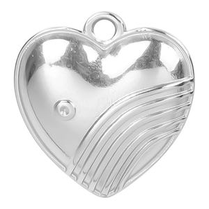 Macro shot of 18k gold plated heart pendant with smooth mirror and wave texture details