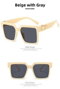 Detail of square beige sunglasses with gray lenses and metallic M logo on temple