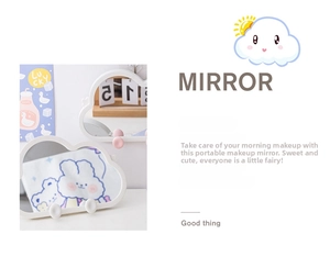 Close-up of cloud-shaped vanity mirror with white frame and pink decorative accents