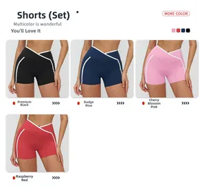 Close-up of cross-waist yoga shorts with side stripes in four vibrant athletic colors