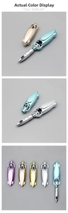 Macro detail of foldable capsule pens in metallic purple gold silver and blue finishes