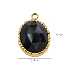 Detail view of oval black faceted gemstone pendant with 15mm by 10.5mm size dimensions
