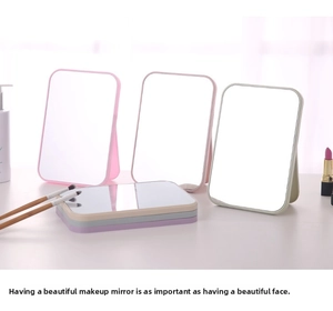 Foldable desktop makeup mirror with adjustable stand in various pastel colors for vanity