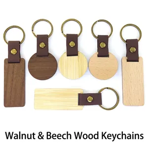 Set of minimalist walnut and beech wood keychains in round and rectangular shapes