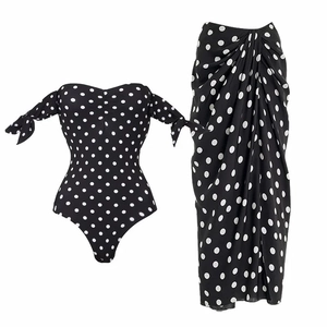 Retro black and white polka dot tube top bodysuit with high-waisted draped skirt set