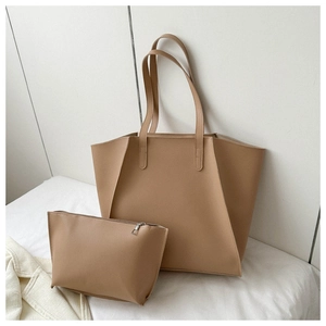 Detail view of brown PU leather tote bag set including a large shopper and small pouch