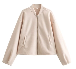 Detail shot of beige fleece zip-up bomber jacket collar with size S label and soft texture