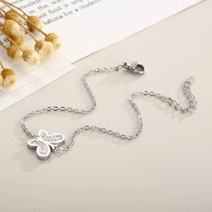 Detailed shot of silver butterfly bracelet with sparkling zircon stones and lobster clasp
