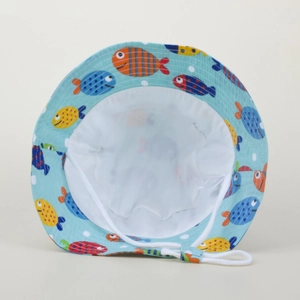 Detail view of baby sun hat featuring colorful fish patterns and white adjustable chin strap