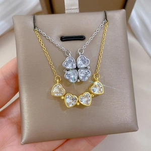 Versatile two-way clover heart necklace in silver and gold with sparkling crystals