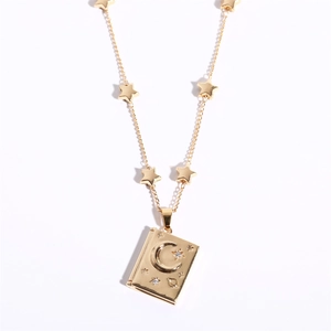 Golden soulmate pendant necklace with crescent moon and star relief on white background