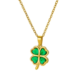 Elegant gold necklace featuring a four-leaf clover pendant with green heart-shaped gems