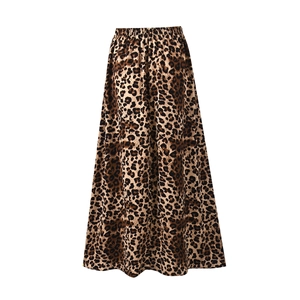 Detail of high waist elastic band and leopard print pattern on A-line maxi skirt