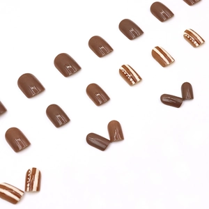 Short square chocolate brown press-on nails with glossy almond red-brown finish