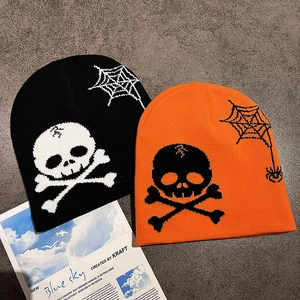 Knitted Halloween beanies in black and orange with skull and spider web patterns