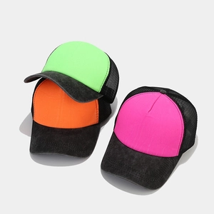 Detailed top view of neon trucker hats in green, orange, and pink with mesh backing