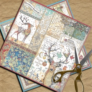 Detail of vintage Christmas scrapbooking paper with deer patterns and gold scissors