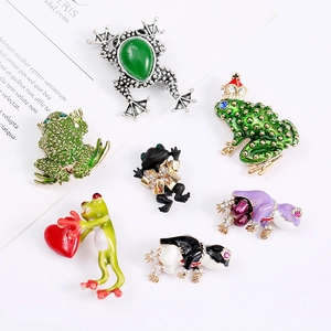 Collection of seven vintage enamel frog brooches with colorful rhinestones and crystals