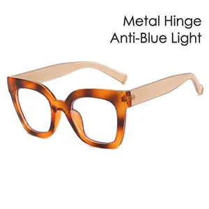 Cat eye blue light blocking glasses with amber frames and beige translucent temples