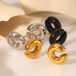 Detailed view of hollow stainless steel C-shaped ear cuffs in gold silver and black finishes