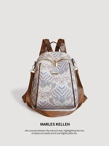 Detail view of ethnic pattern fabric and brown leather trim on a retro backpack