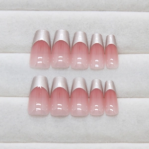 French gradient press-on nails with silver metallic tips and nude base in 24-piece set