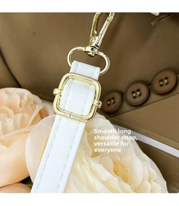 Adjustable white leather shoulder strap with gold-tone hardware detail and lobster clasp