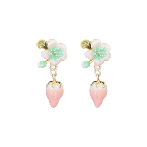 Sweet strawberry enamel drop earrings with white flower detail on a plain white background