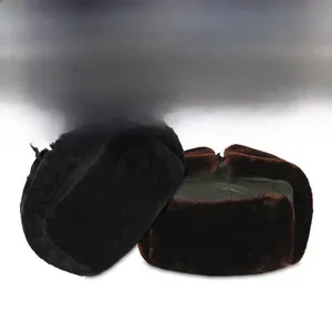 Detail of warm winter trapper hat with faux fur lining in black and dark brown colors