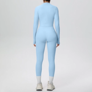 Rear view of light blue yoga set featuring high-waisted leggings and long sleeve cropped top
