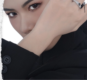 Detail of S925 silver ring with black gemstone and micro diamonds on model finger