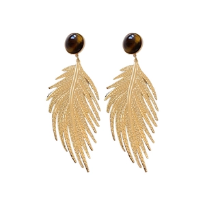 Vintage golden leaf earrings with brown tiger eye stone on a clean white background