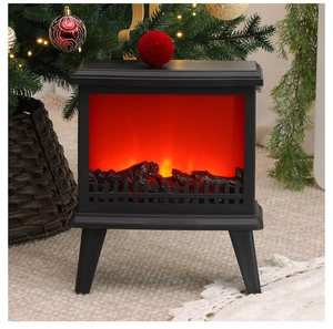 Cozy living room detail showing a black simulation fireplace lamp with realistic flame