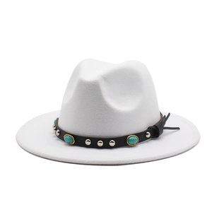 Close-up of a white felt fedora featuring a turquoise and silver studded leather band