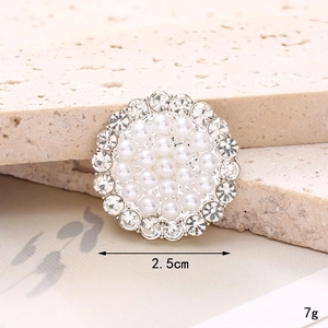 Detailed macro view of a 2.5cm pearl and crystal rhinestone shoe charm decoration